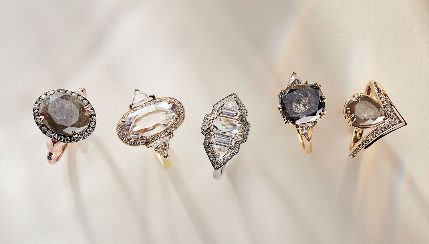 A horizontal cascade of 5 engagement rings by Anna Sheffield, all with large and unique diamonds in one-of-a-kind engagement ring settings.