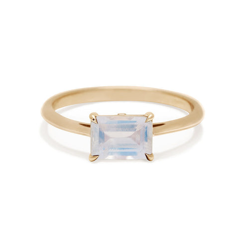 An east/west solitaire ring with an emerald shape rainbow moonstone set in yellow gold., Yellow Gold