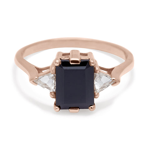 A three stone engagement ring with an emerald cut and emerald shape 8x6mm black diamond center stone with two white diamond trillion side stones set in white gold., White Gold 9