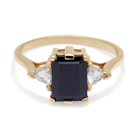A three stone engagement ring with an emerald cut and emerald shape 8x6mm black diamond center stone with two white diamond trillion side stones set in yellow gold., Yellow Gold 7