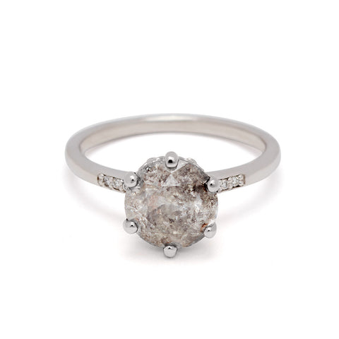 A solitaire ring with a 2.00ct round galaxy grey diamond with white diamond pave on either side set in white gold., White Gold 9