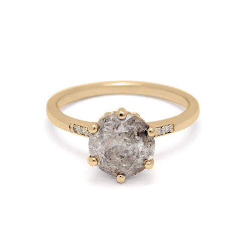 A solitaire ring with a 2.00ct round galaxy grey diamond with white diamond pave on either side set in yellow gold., Yellow Gold