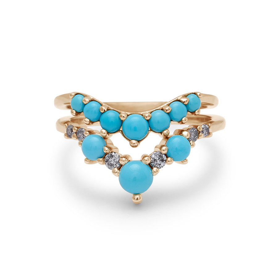 Two nesting bands with turquoise stones one chevron shaped and one curved.