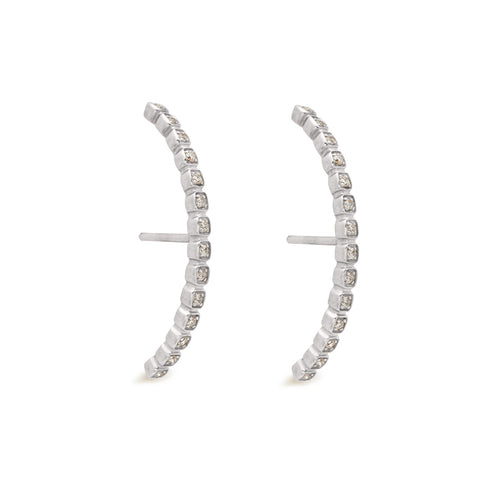 A pair of grey diamond dusted curve earrings set in white gold both earrings angled., White Gold 7