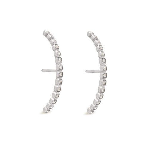 A pair of white diamond dusted curve earrings set in white gold both earrings angled., White Gold 7