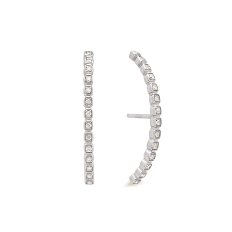A pair of white diamond dusted curve earrings set in white gold one earring angled. 8
