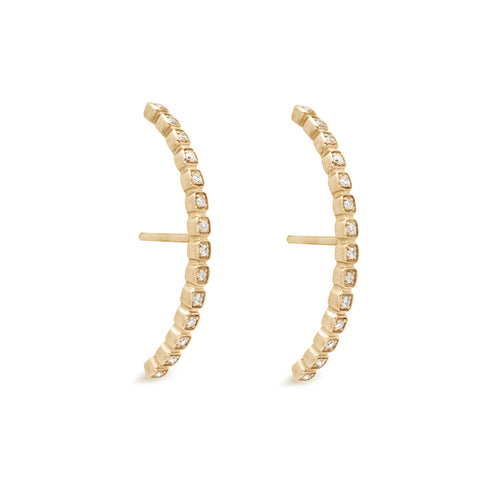 A pair of white diamond dusted curve earrings set in yellow gold both earrings angled., Yellow Gold