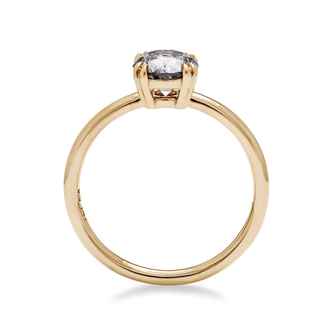Side view of a solitaire round 1.00ct grey diamond ring with double claw prongs set in yellow gold. 2