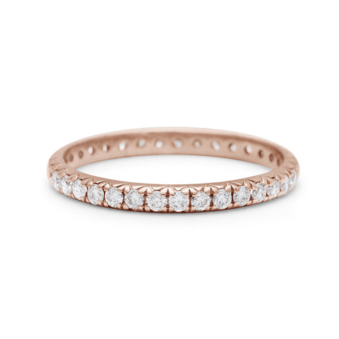A rose gold band with an eternity of round white diamond stones., Rose Gold