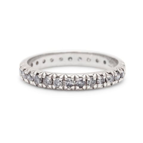 A white gold band with an eternity of round grey diamond stones., White Gold