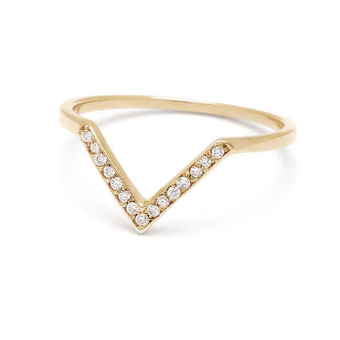 Angled view of a band with 9 round white diamonds set in yellow gold. 4