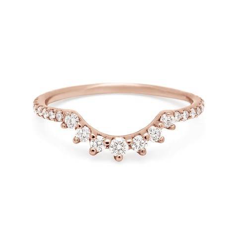 A curve band with 7 white diamonds at the center and white diamond pave around the rest of the band set in rose gold., Rose Gold 4