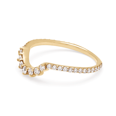 Angled view of a curve band with 7 white diamonds at the center and white diamond pave around the rest of the band set in yellow gold. 3