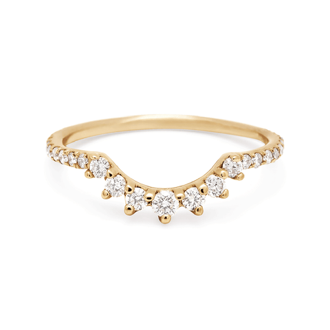 A curve band with 7 white diamonds at the center and white diamond pave around the rest of the band set in yellow gold., Yellow Gold