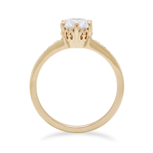 Side view of a solitaire ring with a round shape 1.00ct white diamond with white diamond pave on either side set in yellow gold., Yellow Gold