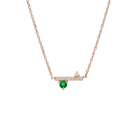 A straight line of white diamond pave with emerald accent stones on either side set in a rose gold necklace chain., Rose Gold