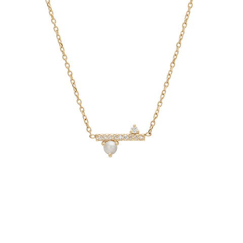 A straight line of white diamond pave with a pearl accent stone on one side set in a yellow gold necklace chain., Yellow Gold
