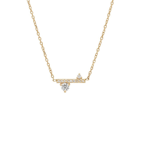 A straight line of white diamond pave with white diamond accent stones on either side set in a yellow gold necklace chain., Yellow Gold