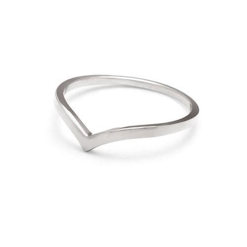 Angled view of a solid gold band in a pointed shape set in white gold.