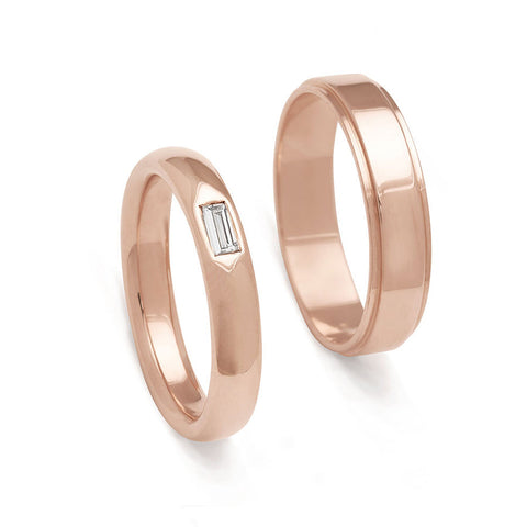 A 4mm classic round band with a white diamond baguette set in rose gold next to a 4mm flat edge band in rose gold.