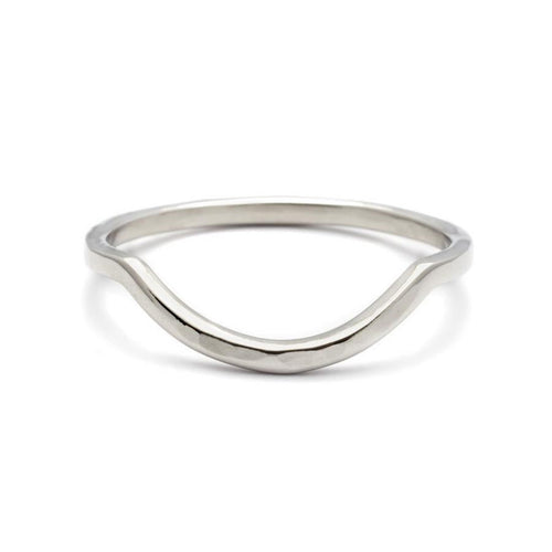 A curved solid hammered gold band set in white gold., White Gold