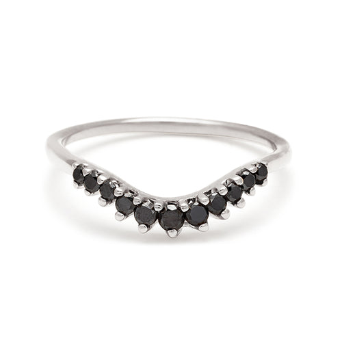 A curved 11 black diamond band set in white gold., White Gold