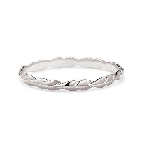 A tiny straight band with leaf like definition set in white gold., White Gold