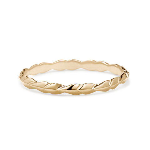 A tiny straight band with leaf like definition set in yellow gold., Yellow Gold