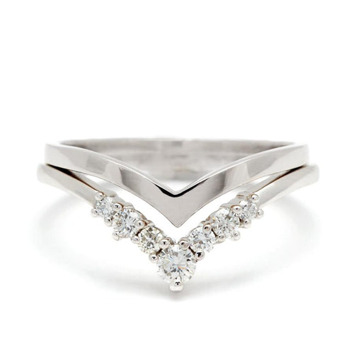 A pointed shape in solid gold stacked above an ascending size white diamond nesting band both in white gold. Available in Yellow Gold, Rose Gold, White Gold.