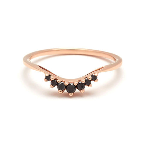 A curved band with 7 black diamonds in ascending and descending size set in rose gold., Rose Gold