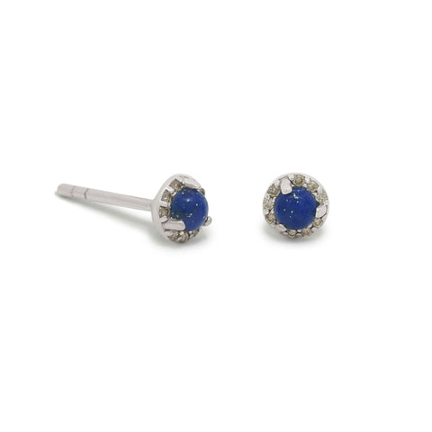 Pair of silver earrings with blue lapis lazuli gemstones encircled with tiny champagne diamonds on a white background 3