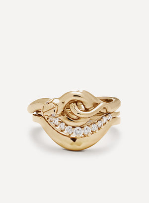 A 14k yellow gold wedding band suite with a serpent band with two white diamonds for eyes. A curved shape band with 11 white diamonds that taper in size towards the outside set below. And a hammered curve band in 14k yellow gold set below that.
