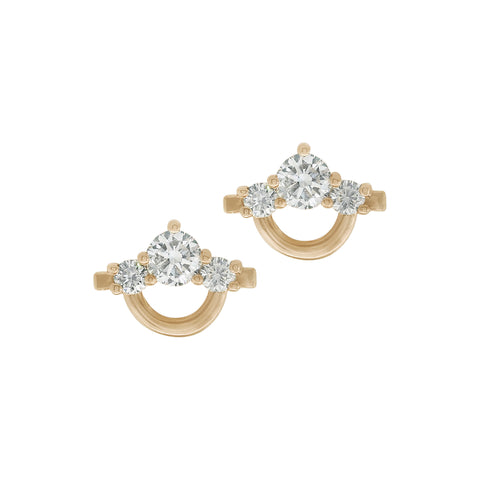 Gold earrings with white diamonds on a white background