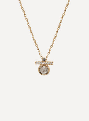 A 14k yellow gold chain necklace with a pear shaped charm. The pear charm is made of multiple colors of diamonds.