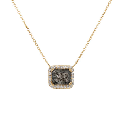 Necklace with a square pendant featuring a black rutile quartz stone and gold and white diamond halo on a white background