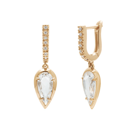 A pair of drop earrings with a U shaped hoop with white diamond pave and a pear shaped white diamond set in yellow gold one earring angled.