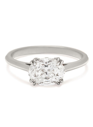 An east/west solitaire ring with an oval brilliant cut white diamond stone set in white gold.