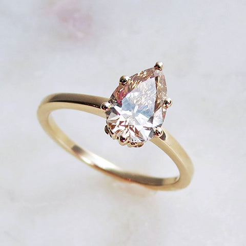 Bespoke pear shape engagement ring with champagne diamond by anna sheffield.