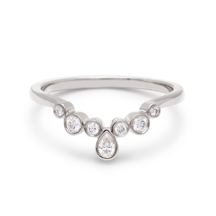 A band with bezel set white diamonds in ascending size set in white gold., White Gold