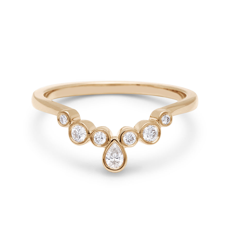 A band with bezel set white diamonds in ascending size set in yellow gold., Yellow Gold