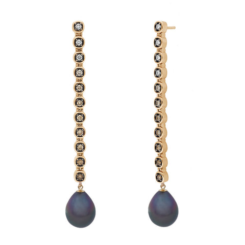 A pair of cascading line drop earrings with white and champagne diamonds set in eternity with Tahitian pearls at the ends with rhodium set in yellow gold.