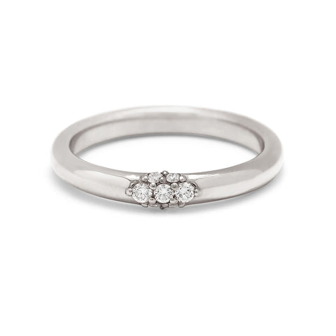 Silver ring with a decorative design on a white background