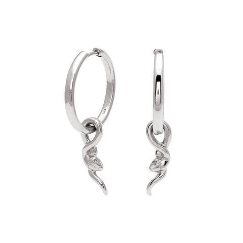 A pair of hoop earrings with a serpent charm at the bottom set in sterling silver one earring angled.