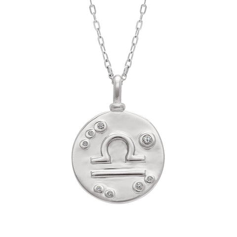 A 18mm charm with the Libra zodiac sign set in sterling silver with grey diamond stones on a sterling silver chain.
