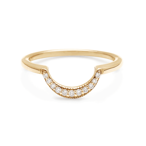 A crescent shaped band with 9 white diamonds set in yellow gold.