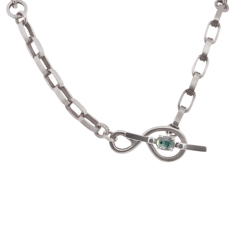 Silver chain necklace with a green moss agate gemstone on a white background