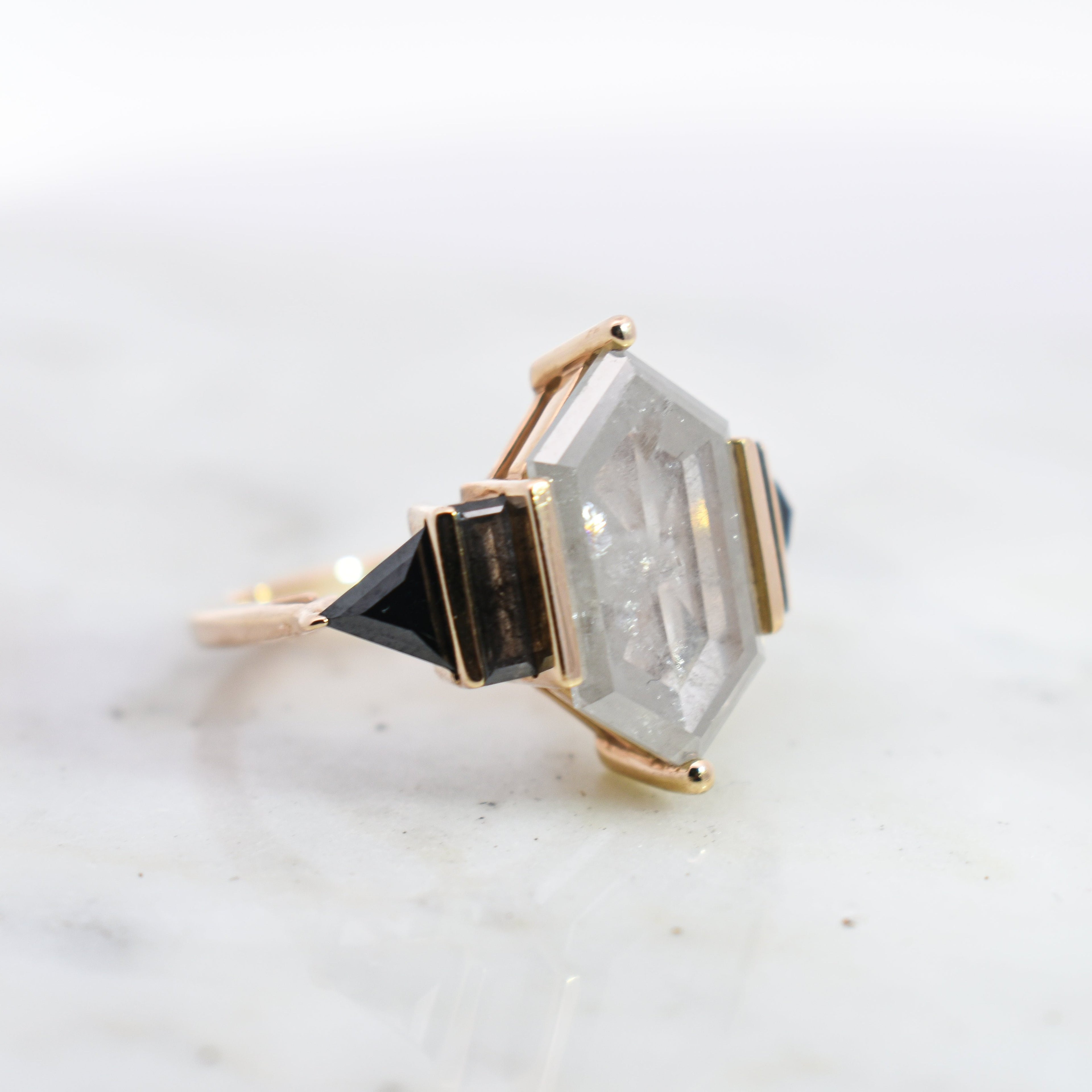 Side view of grey diamond hex theda ring