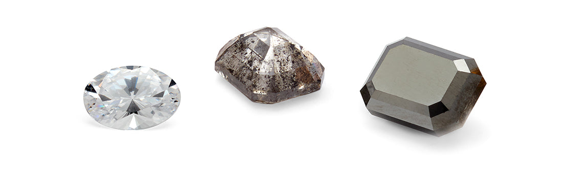 An image of a white diamond, a grey diamond, and a black diamond on a flat surface