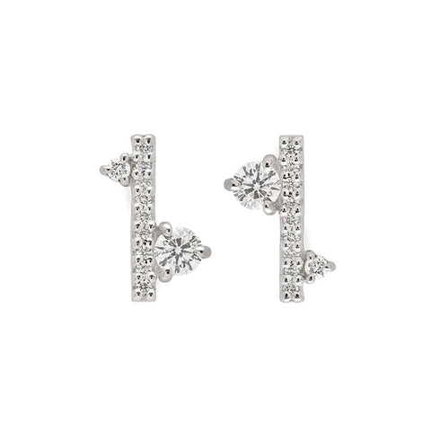A pair of earrings with straight lines of white diamond pave with white diamond accent stones on either side set in a white gold., White Gold