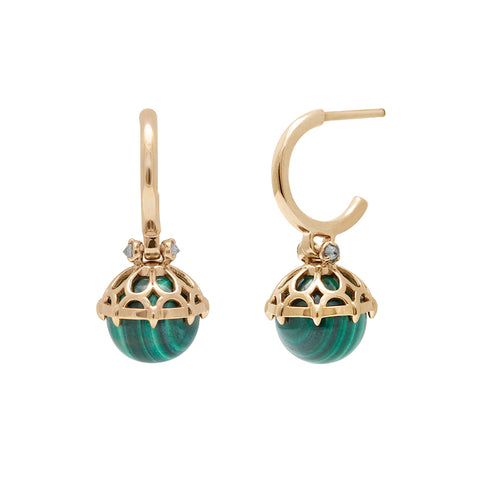 A pair of hoops with a malachite stone hanging from it with grey diamond accents on either side set in yellow gold one earring angled.